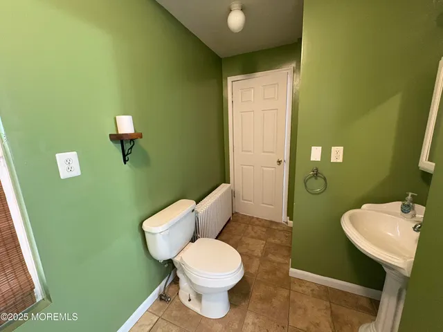 a bathroom with a toilet and a sink
