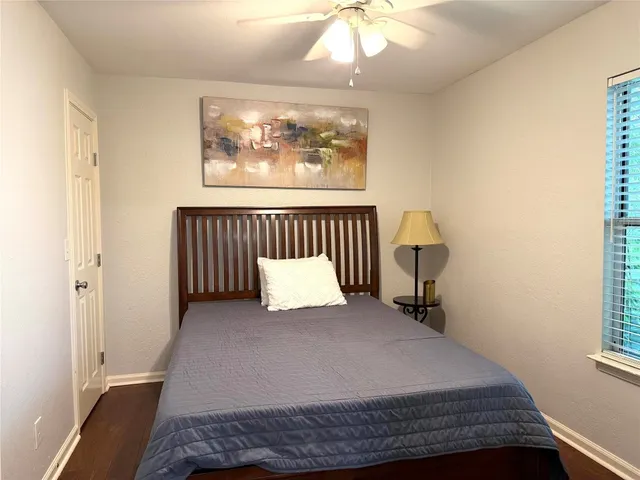 a bedroom with a bed and window