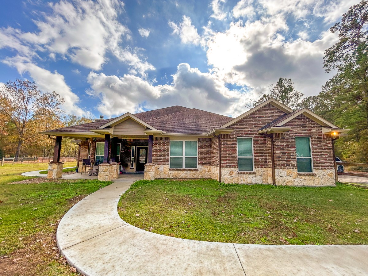 675 Somerset Trail Point Blank, TX 77364 - Photo 11 of 43 a front view of a house with a yard
