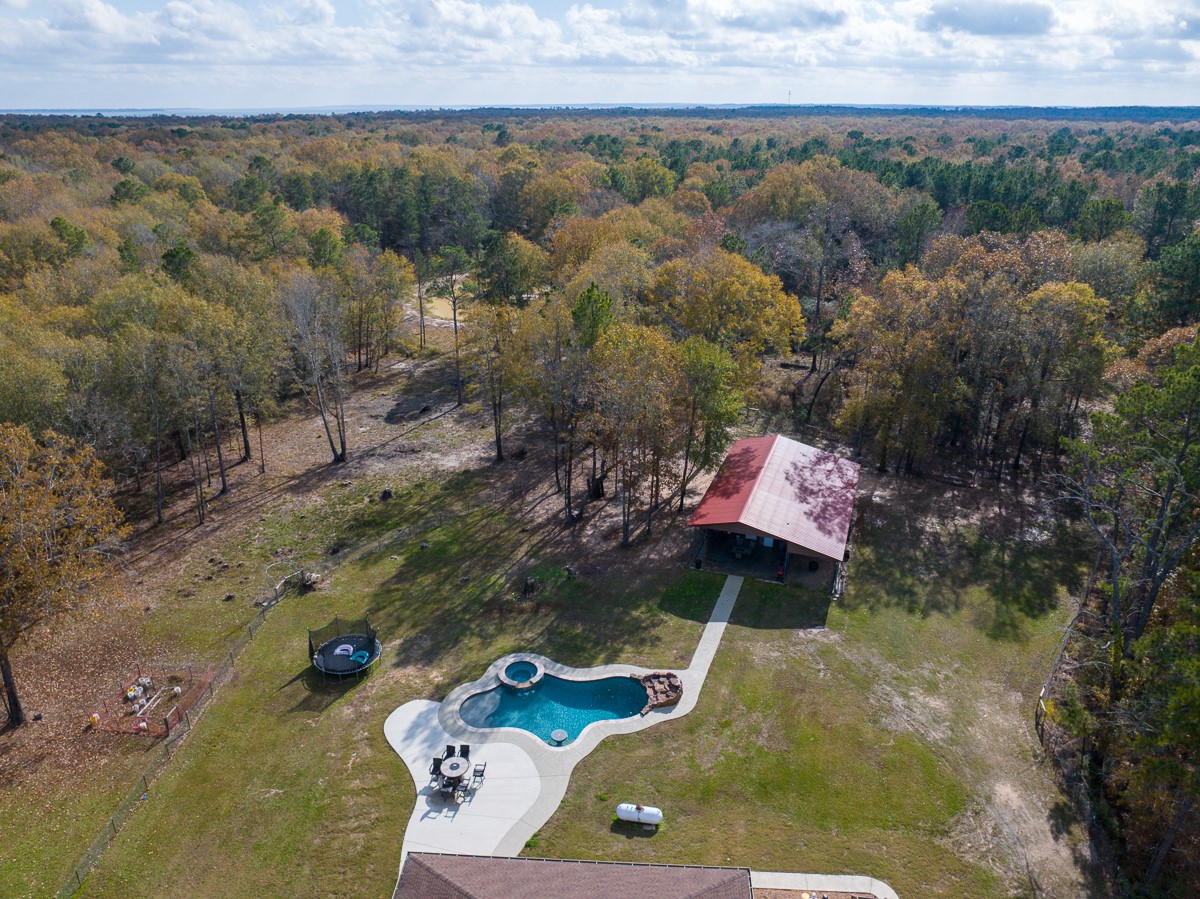675 Somerset Trail Point Blank, TX 77364 - Photo 6 of 43 an aerial view of a house with a yard
