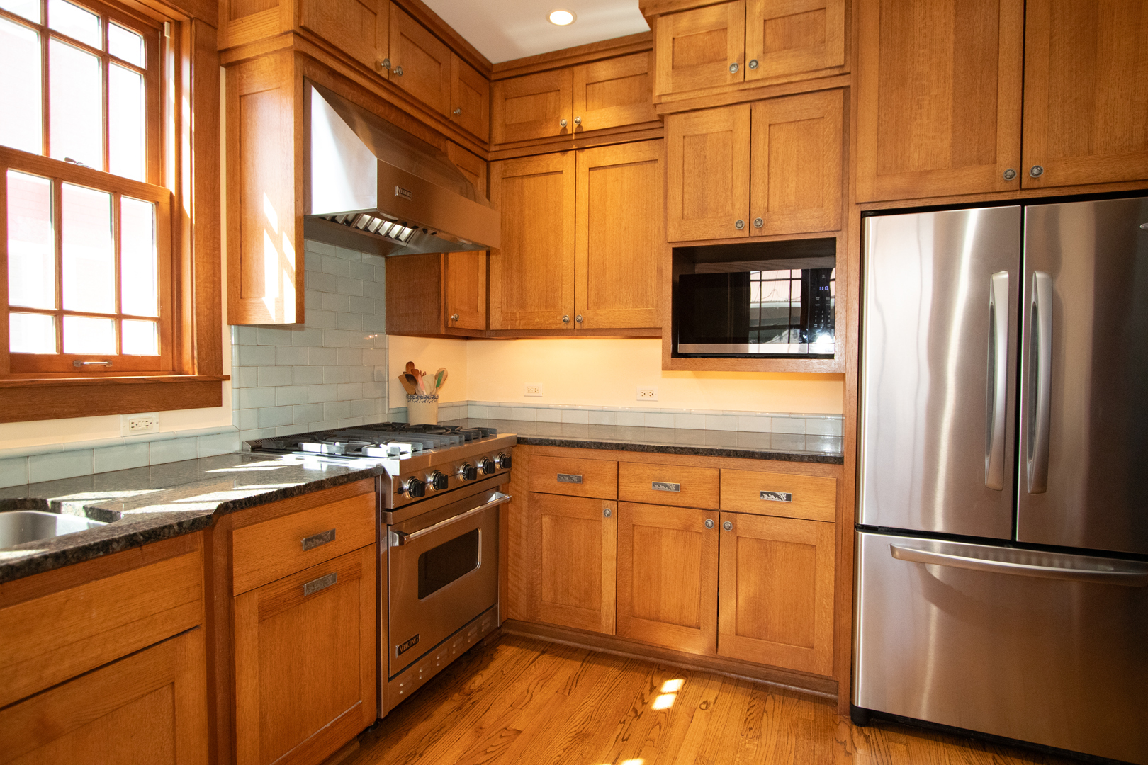227 Thatcher Avenue River Forest, IL 60305 - Photo 17 of 42 a kitchen with stainless steel appliances granite countertop a refrigerator a stove a sink and a microwave