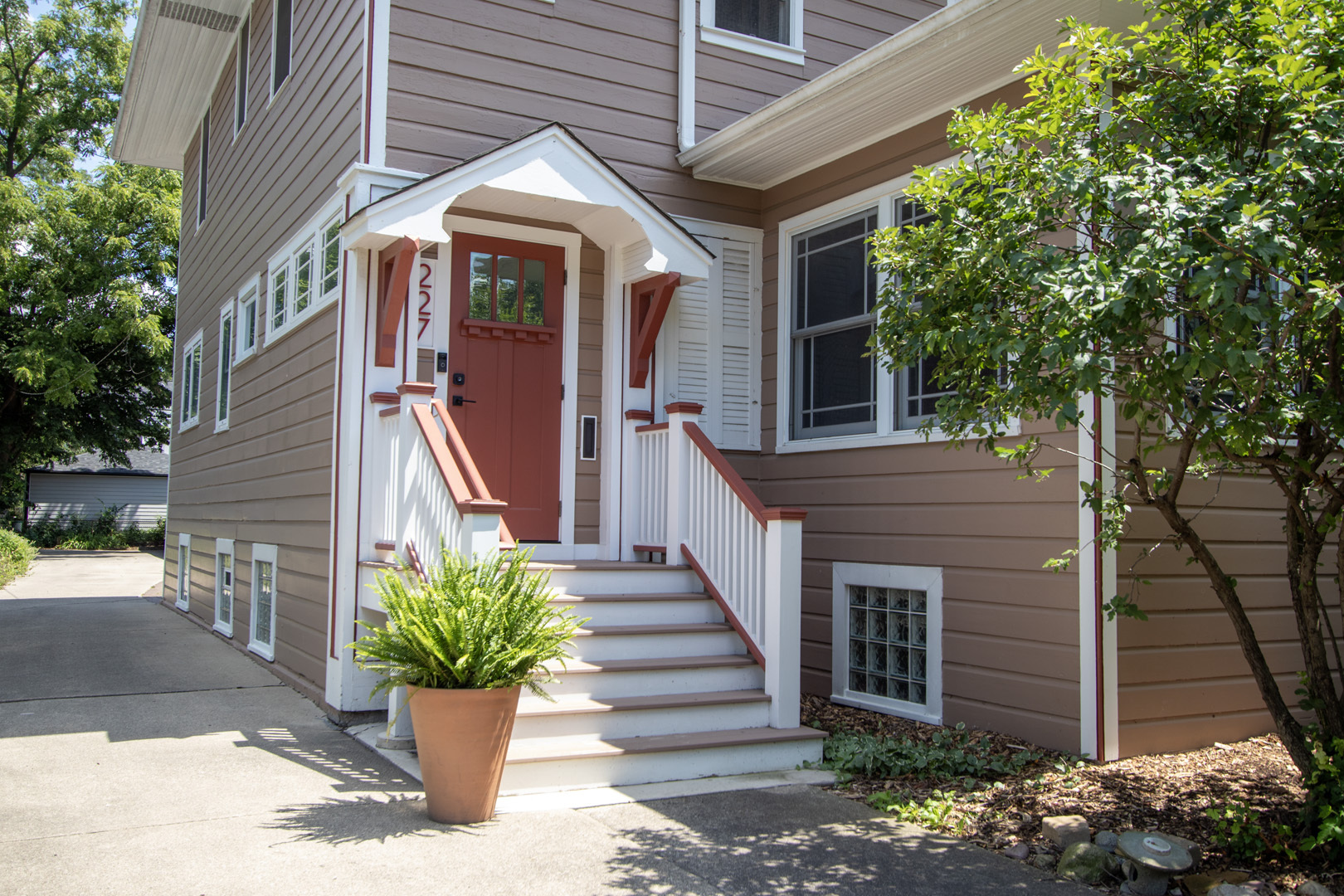 227 Thatcher Avenue River Forest, IL 60305 - Photo 2 of 42 a front view of a house with a garden