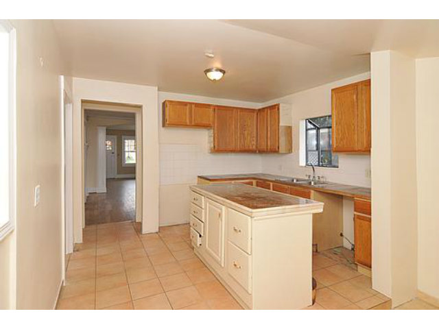22 Bloomfield Road Burlingame, CA 94010 - Photo 5 of 8 a kitchen with a stove a sink and a refrigerator