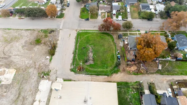 an aerial view of a houses with outdoor space