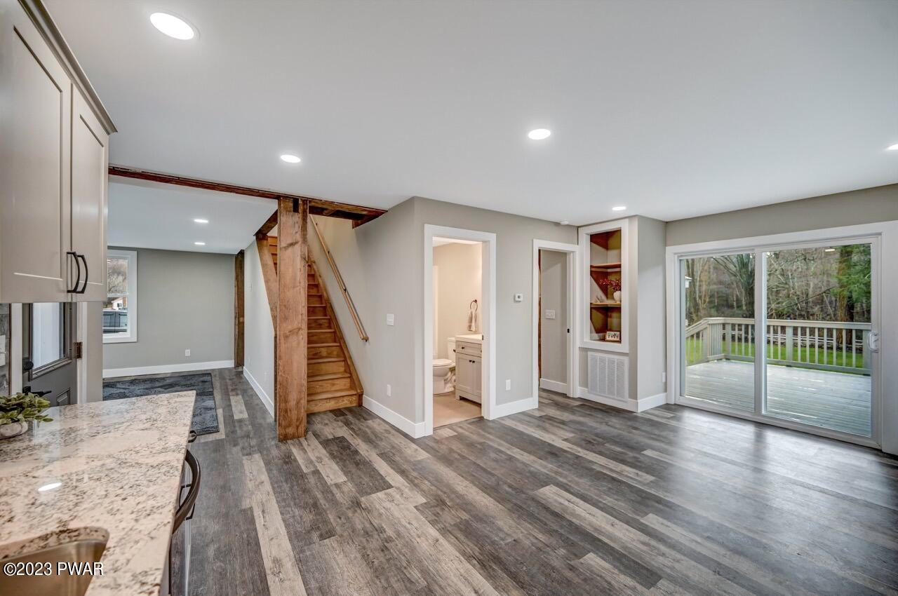 16 Pond Road Moscow, PA 18444 - Photo 14 of 55 a view of empty room with wooden floor and fan