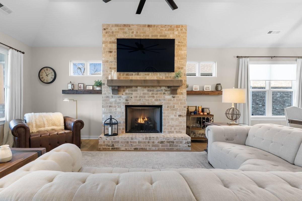 1049 Fallow Road Mount Juliet, TN 37122 - Photo 11 of 55 a living room with furniture a fireplace and a flat screen tv
