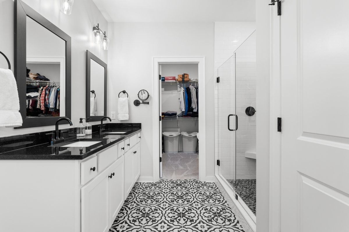 1049 Fallow Road Mount Juliet, TN 37122 - Photo 19 of 55 a spacious bathroom with a granite countertop sink and a mirror