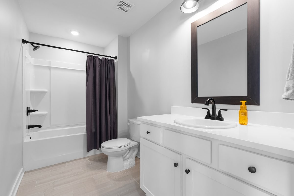 1049 Fallow Road Mount Juliet, TN 37122 - Photo 31 of 55 a bathroom with a sink a toilet and a mirror