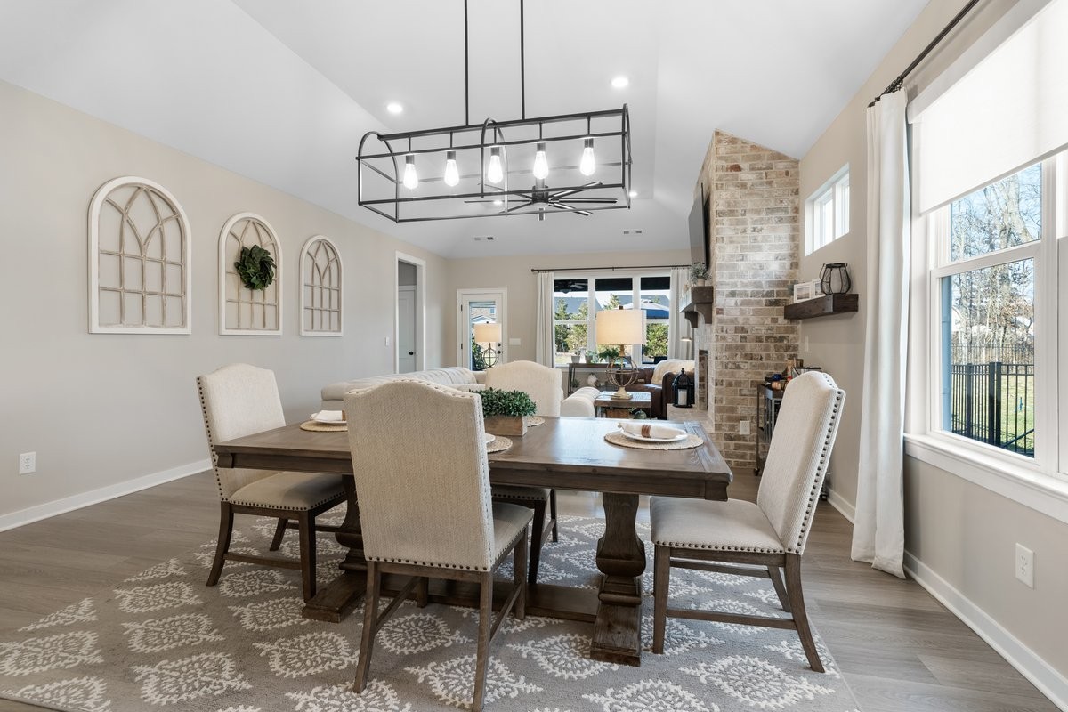 1049 Fallow Road Mount Juliet, TN 37122 - Photo 10 of 55 a view of a dining room with furniture a chandelier and wooden floor