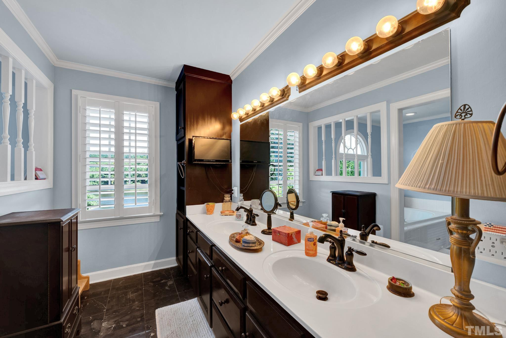 207 Holly Circle Clayton, NC 27527 - Photo 20 of 30 a bathroom with a sink double vanity and a mirror