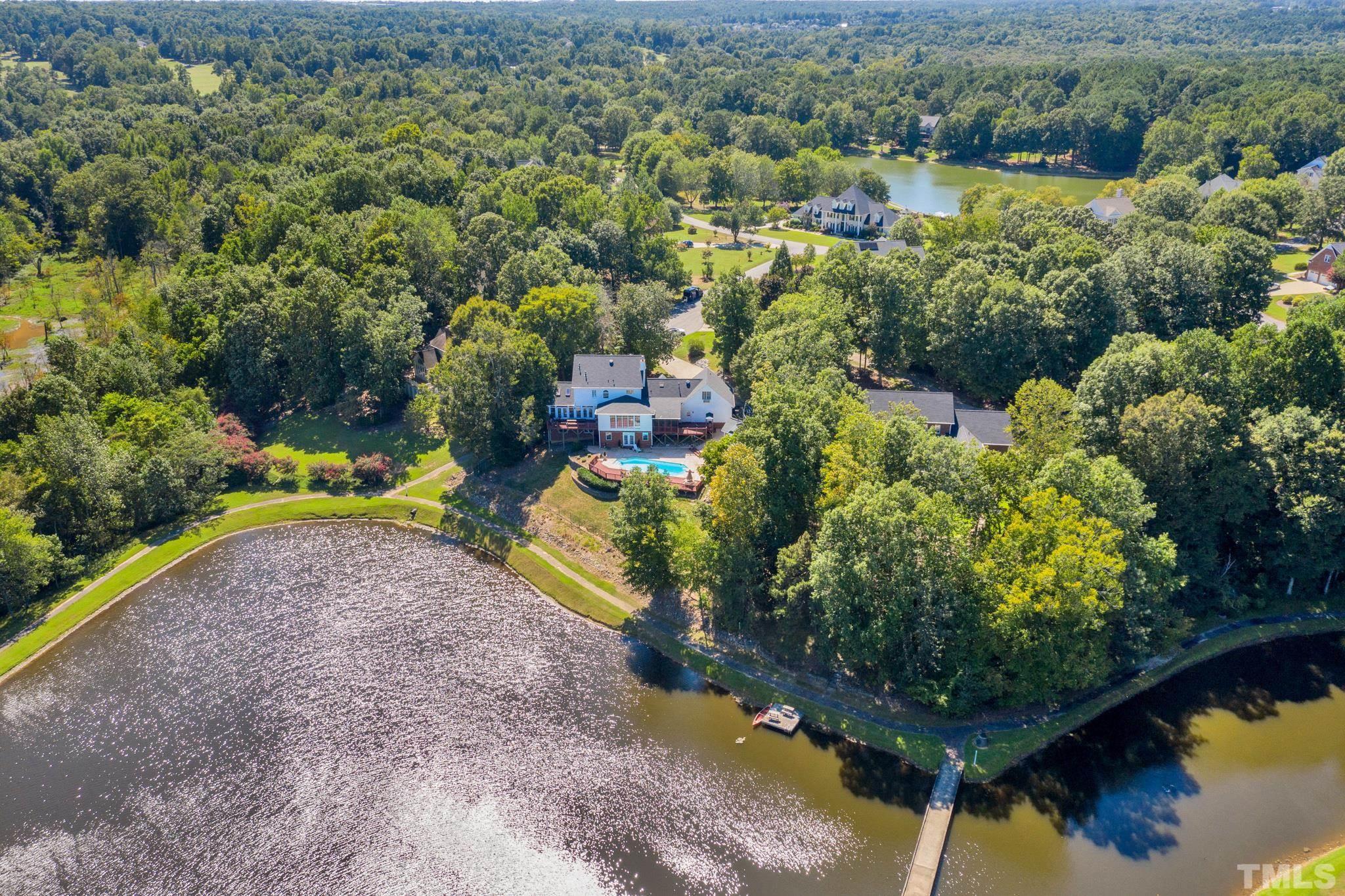 207 Holly Circle Clayton, NC 27527 - Photo 2 of 30 a view of a lake with a park