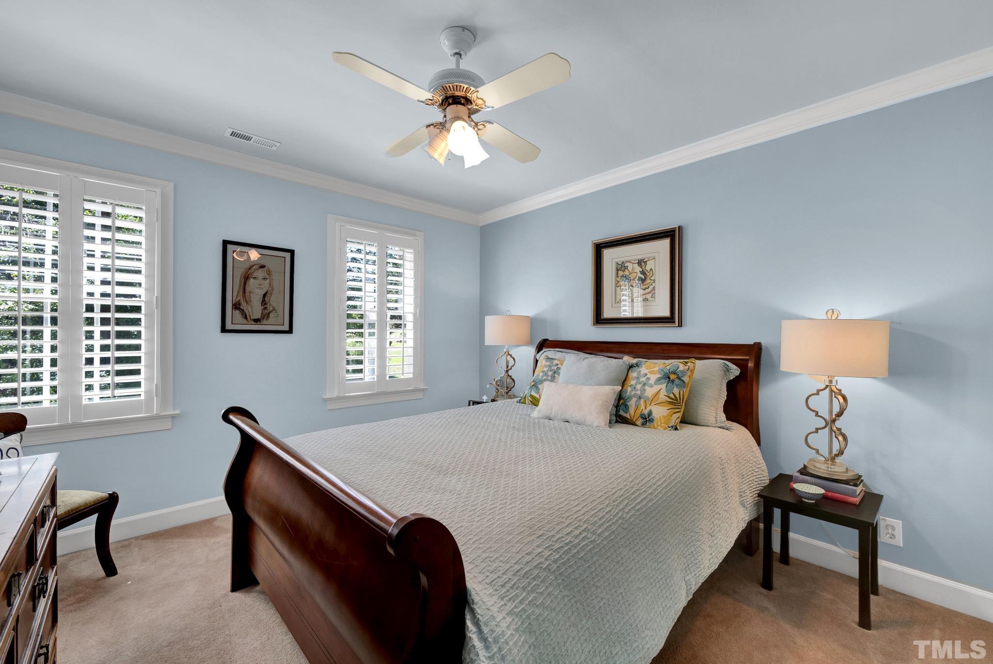 207 Holly Circle Clayton, NC 27527 - Photo 22 of 30 a bed room with a bed and a chair