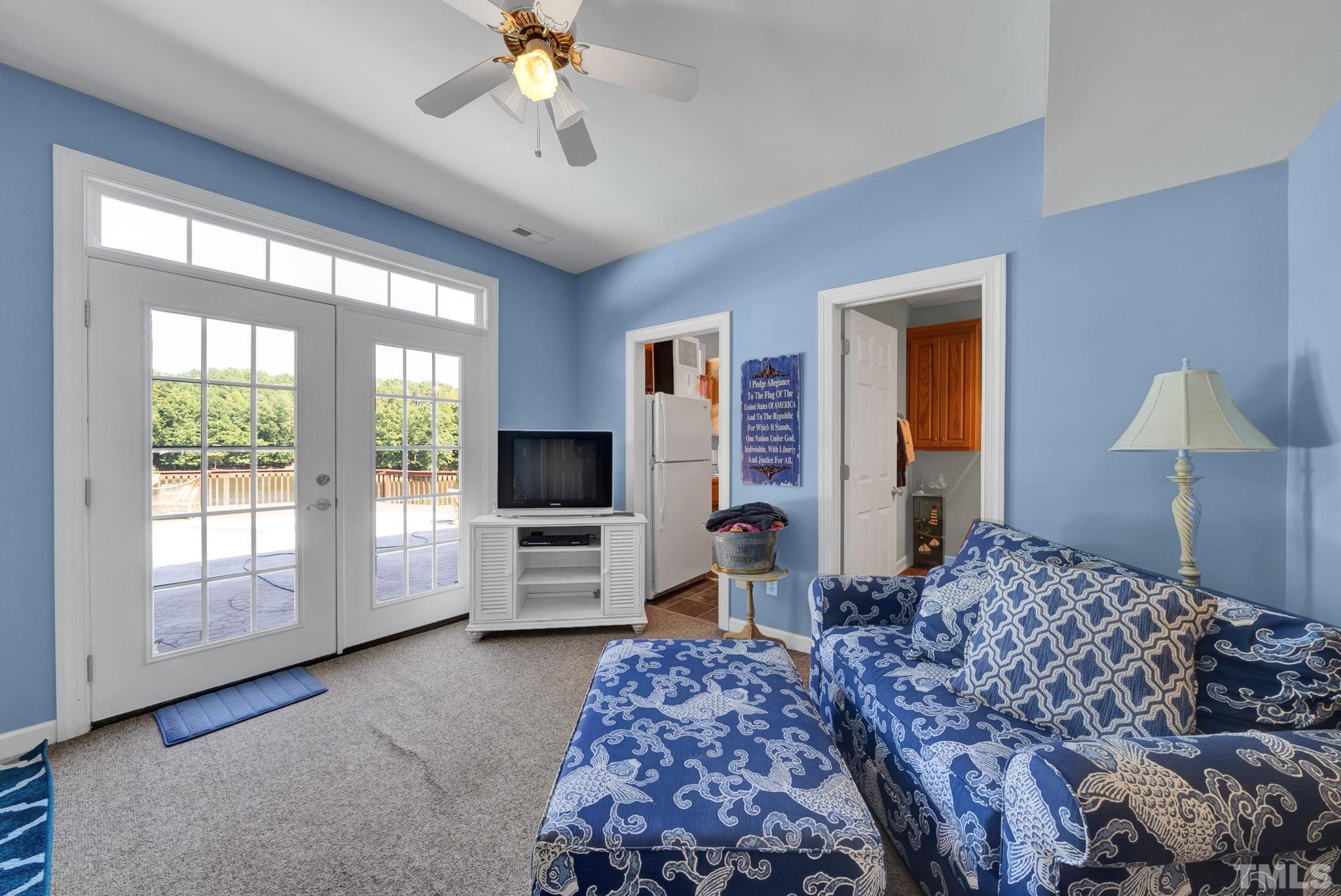 207 Holly Circle Clayton, NC 27527 - Photo 25 of 30 a bedroom with a large bed and a flat tv screen