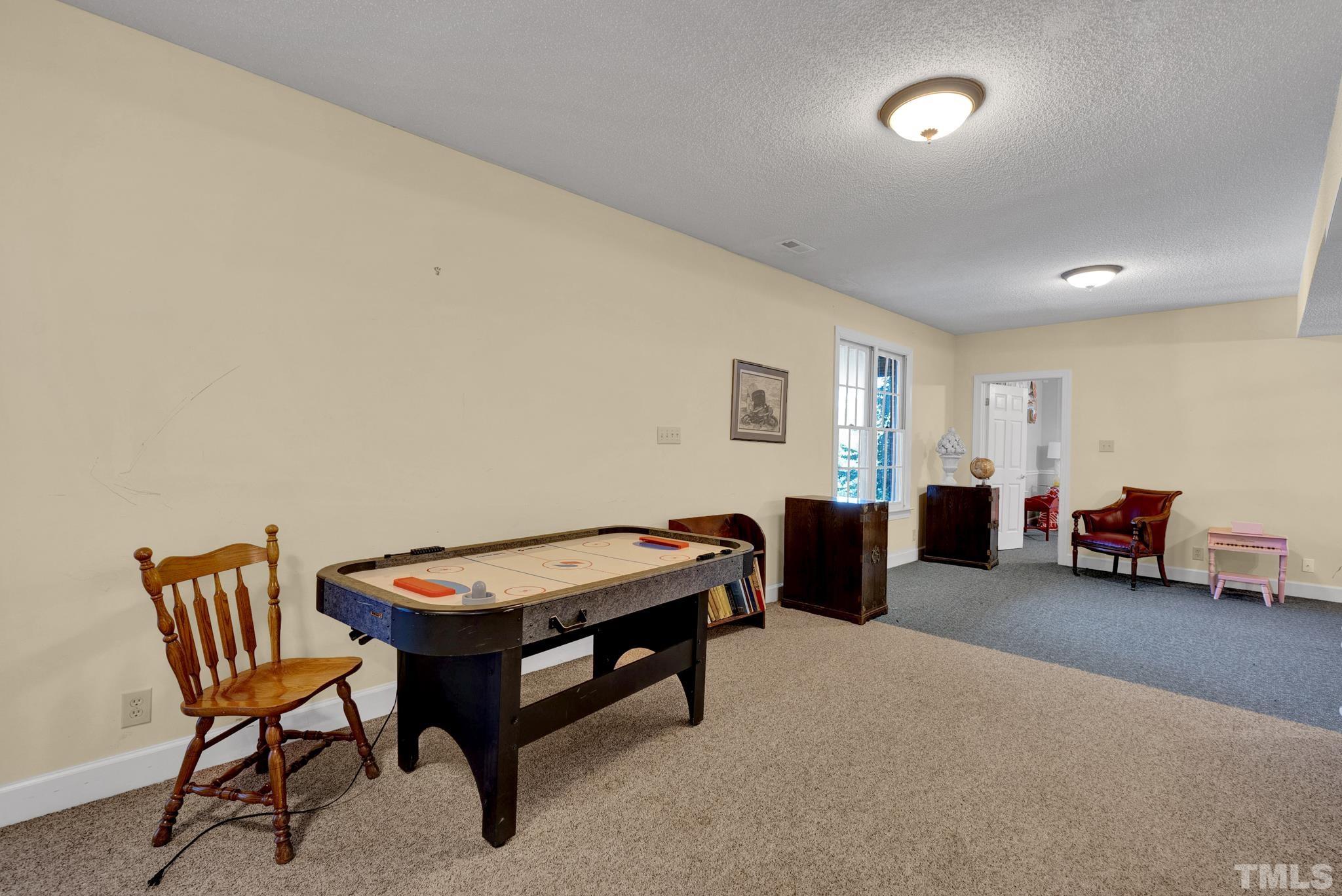 207 Holly Circle Clayton, NC 27527 - Photo 29 of 30 a living room with furniture and a couch