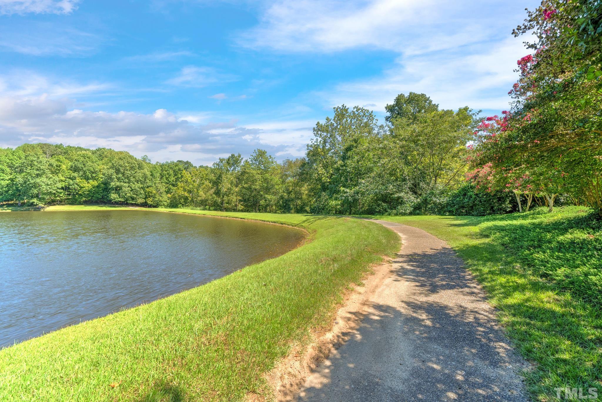 207 Holly Circle Clayton, NC 27527 - Photo 6 of 30 a view of a lake with a yard
