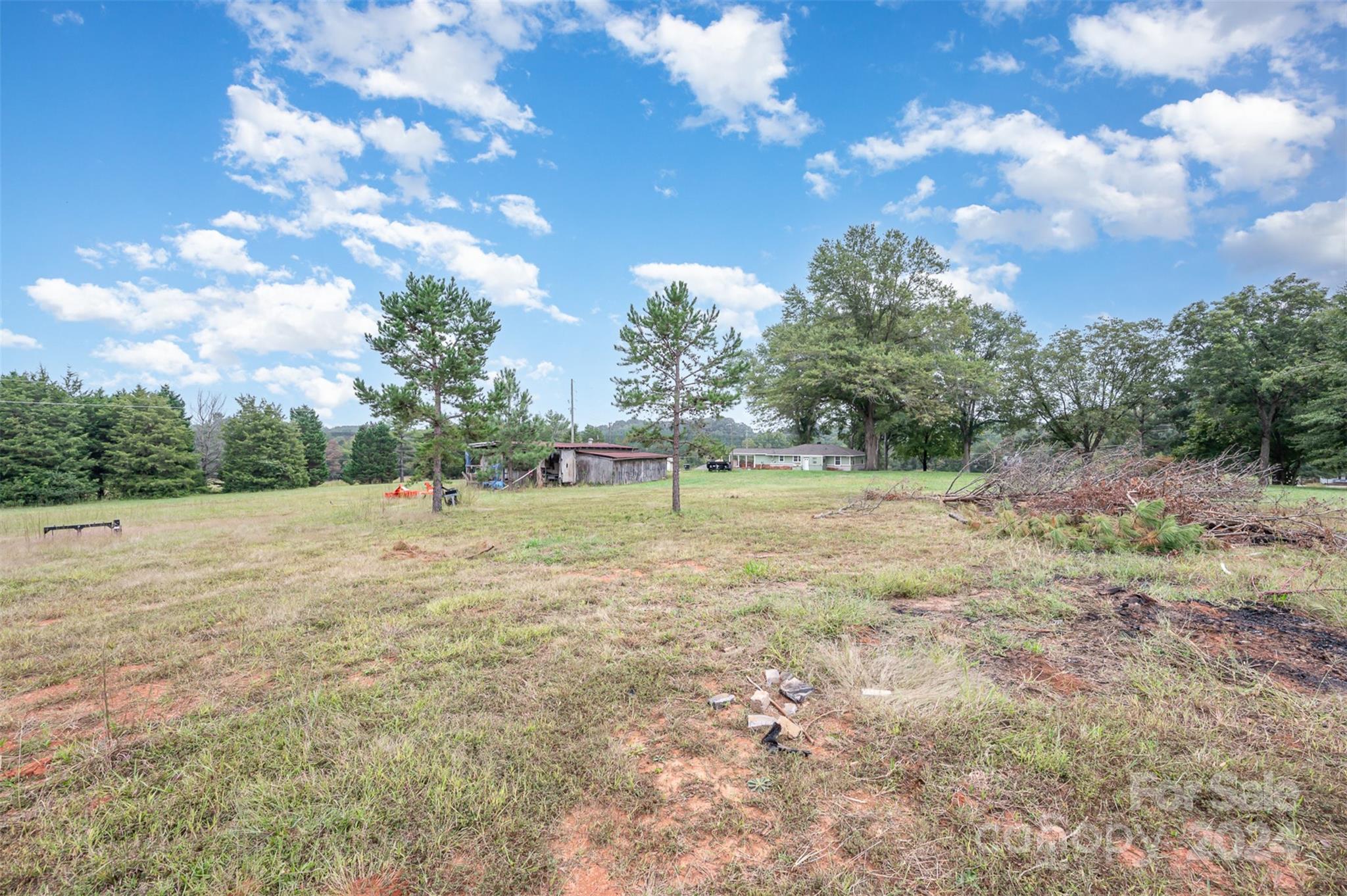 3869 Randleman Road Iron Station, NC 28080 - Photo 15 of 16 a view of outdoor space with deck and yard