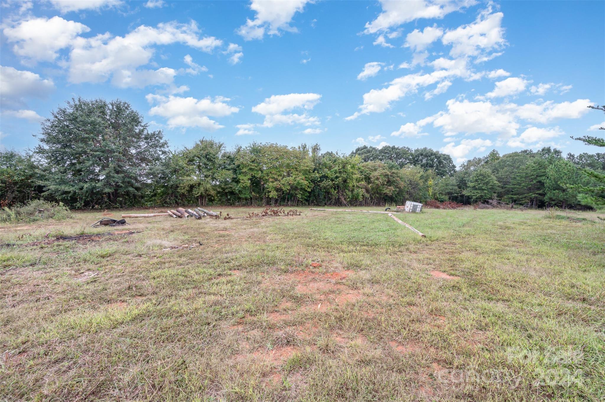 3869 Randleman Road Iron Station, NC 28080 - Photo 16 of 16 a backyard of a house with lots of green space