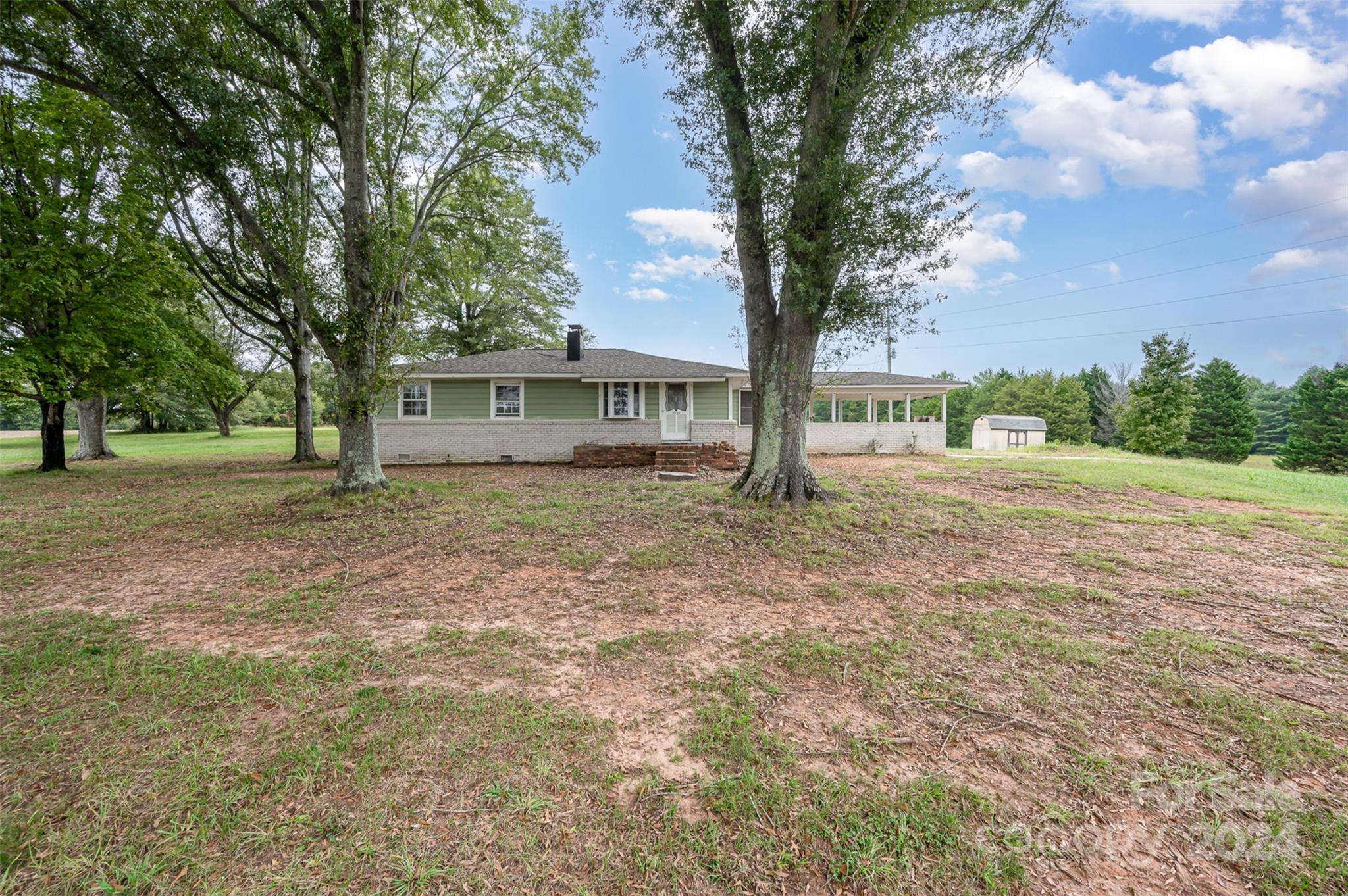 3869 Randleman Road Iron Station, NC 28080 - Photo 3 of 16 a view of a house with a yard