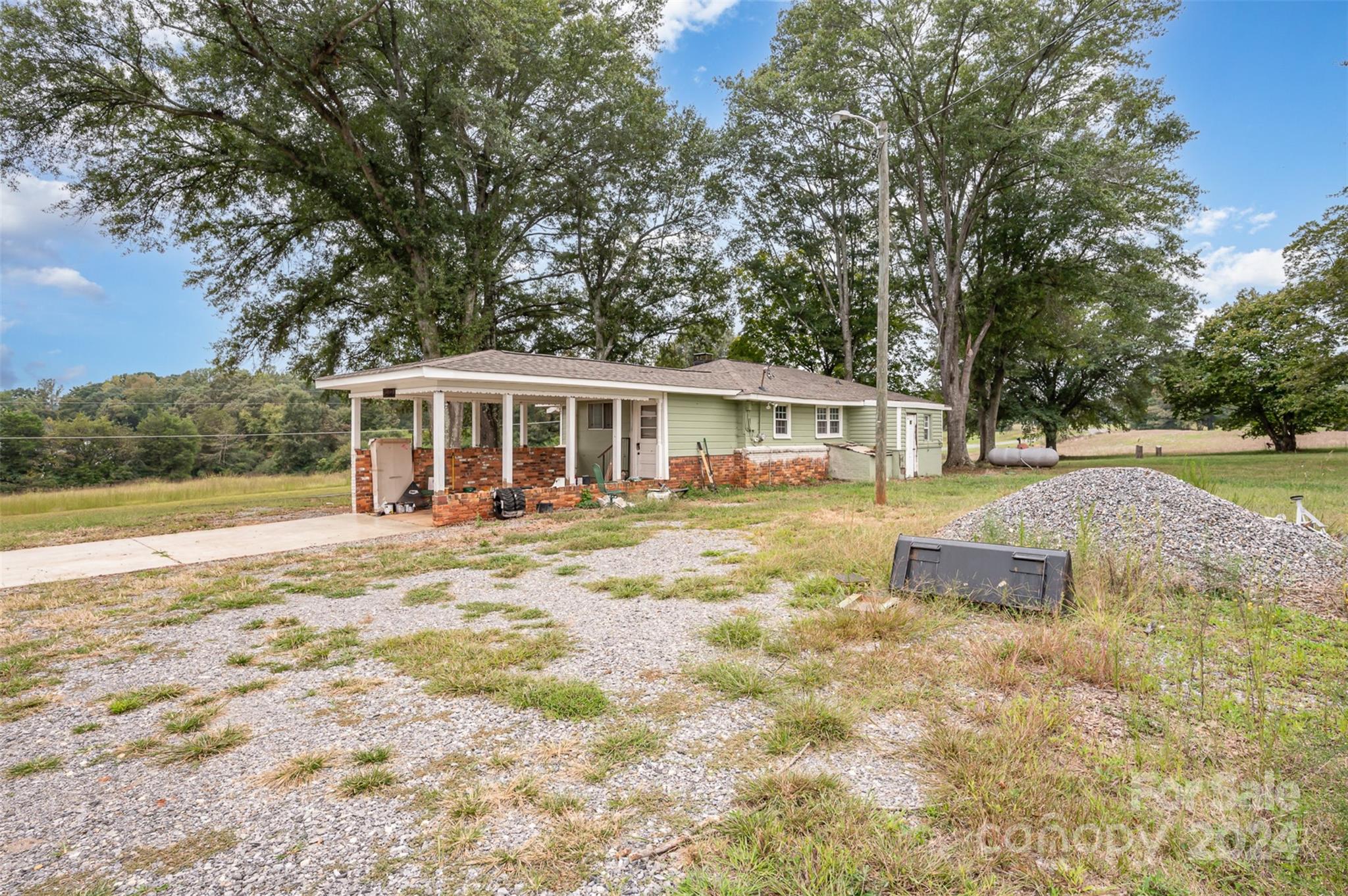 3869 Randleman Road Iron Station, NC 28080 - Photo 6 of 16 a view of a house with yard and sitting area