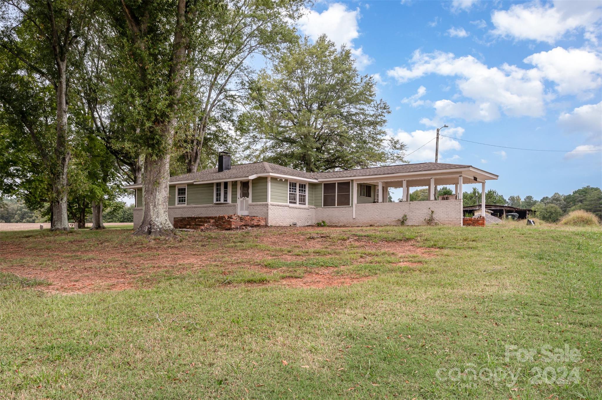 3869 Randleman Road Iron Station, NC 28080 - Photo 8 of 16 a front view of a house with a garden