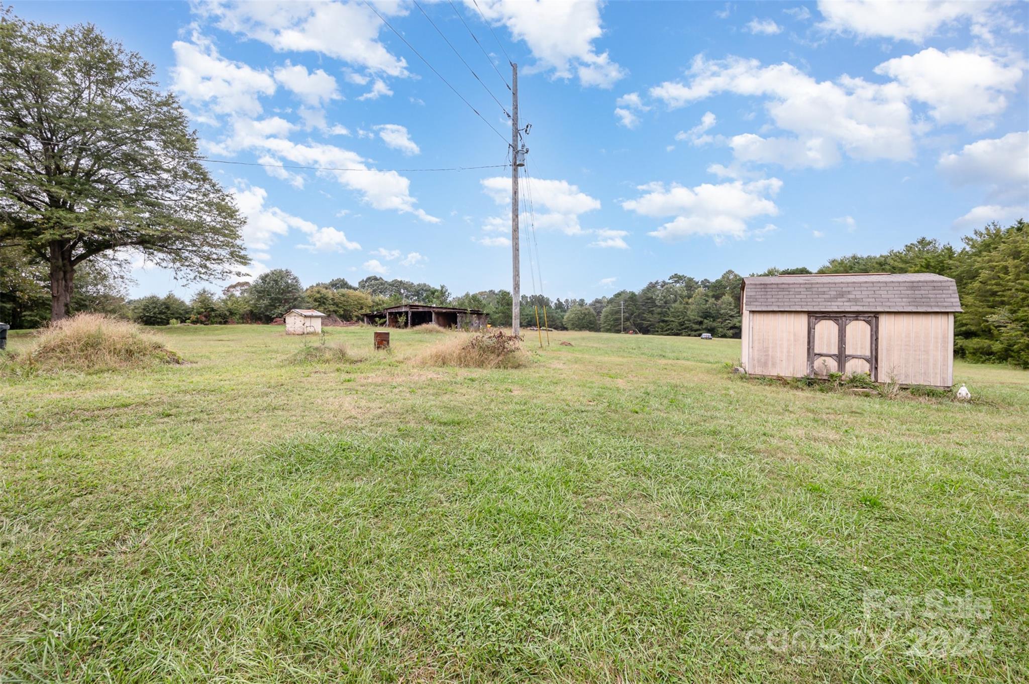 3869 Randleman Road Iron Station, NC 28080 - Photo 9 of 16 a view of a lake with a big yard