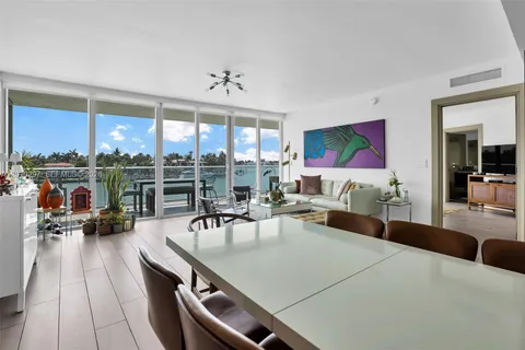 a view of a living room and dining room
