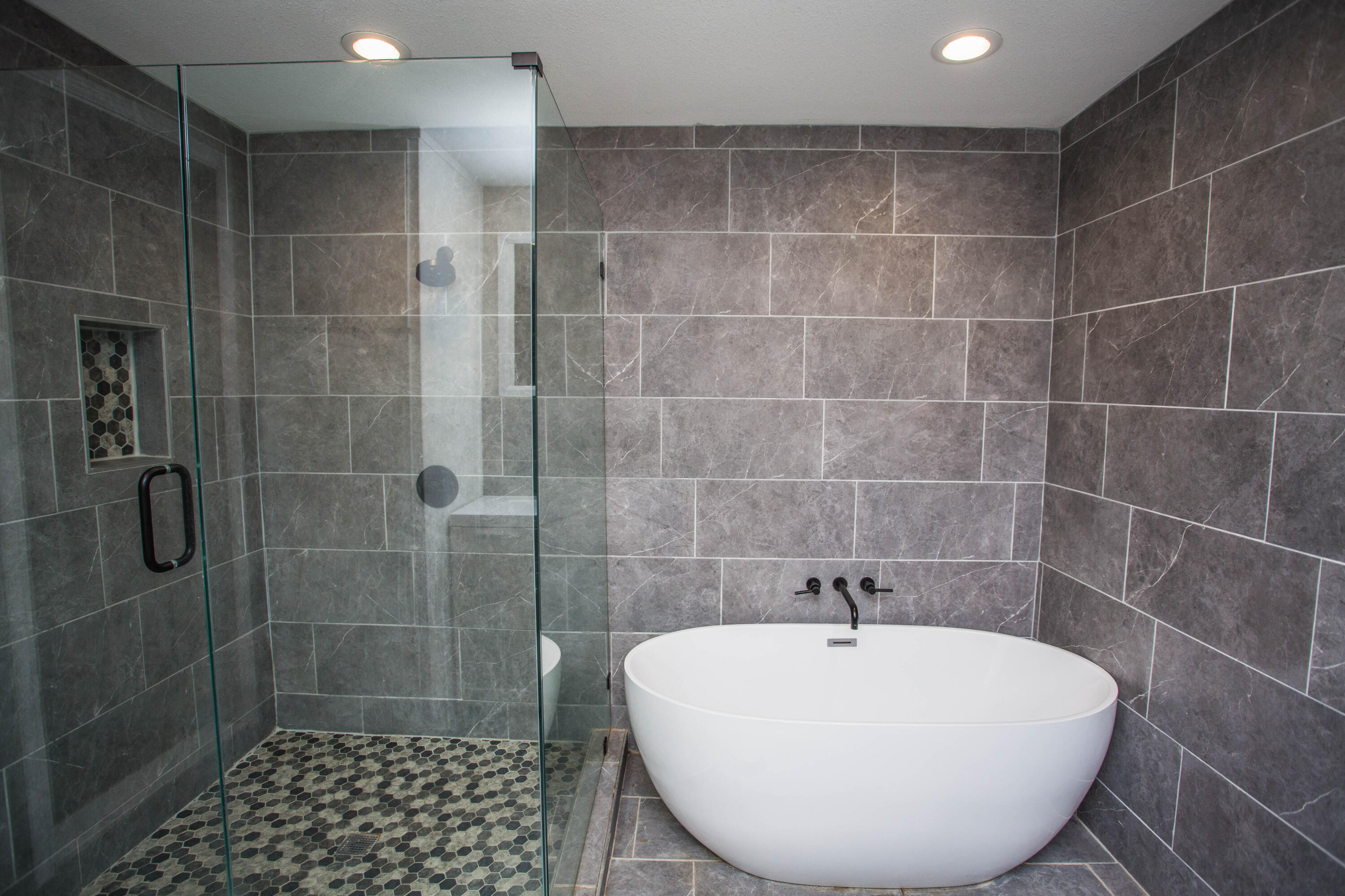 4213 40th Street Lubbock, TX 79413 - Photo 14 of 30 a bathroom with a shower