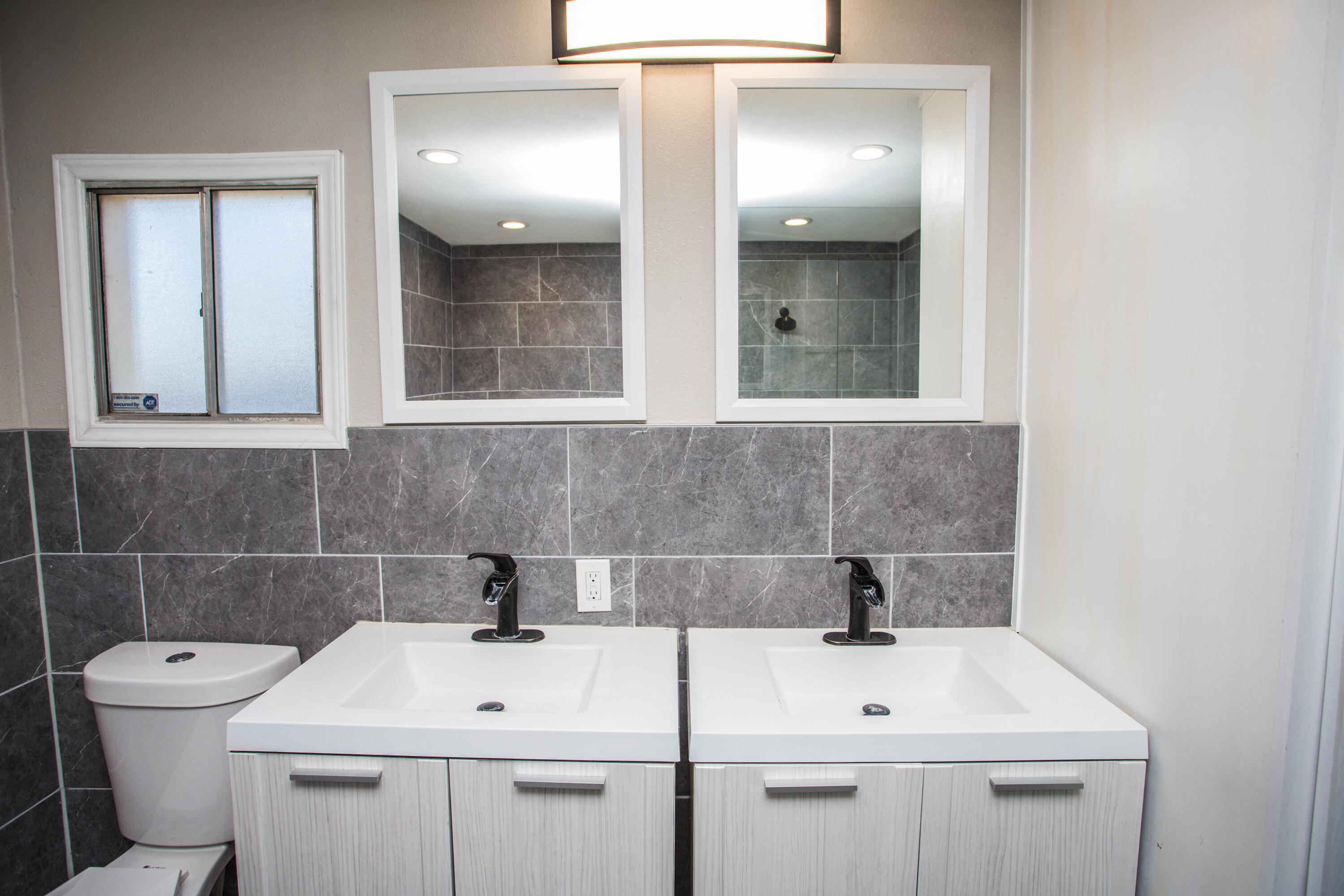 4213 40th Street Lubbock, TX 79413 - Photo 16 of 30 a bathroom with a sink and a toilet