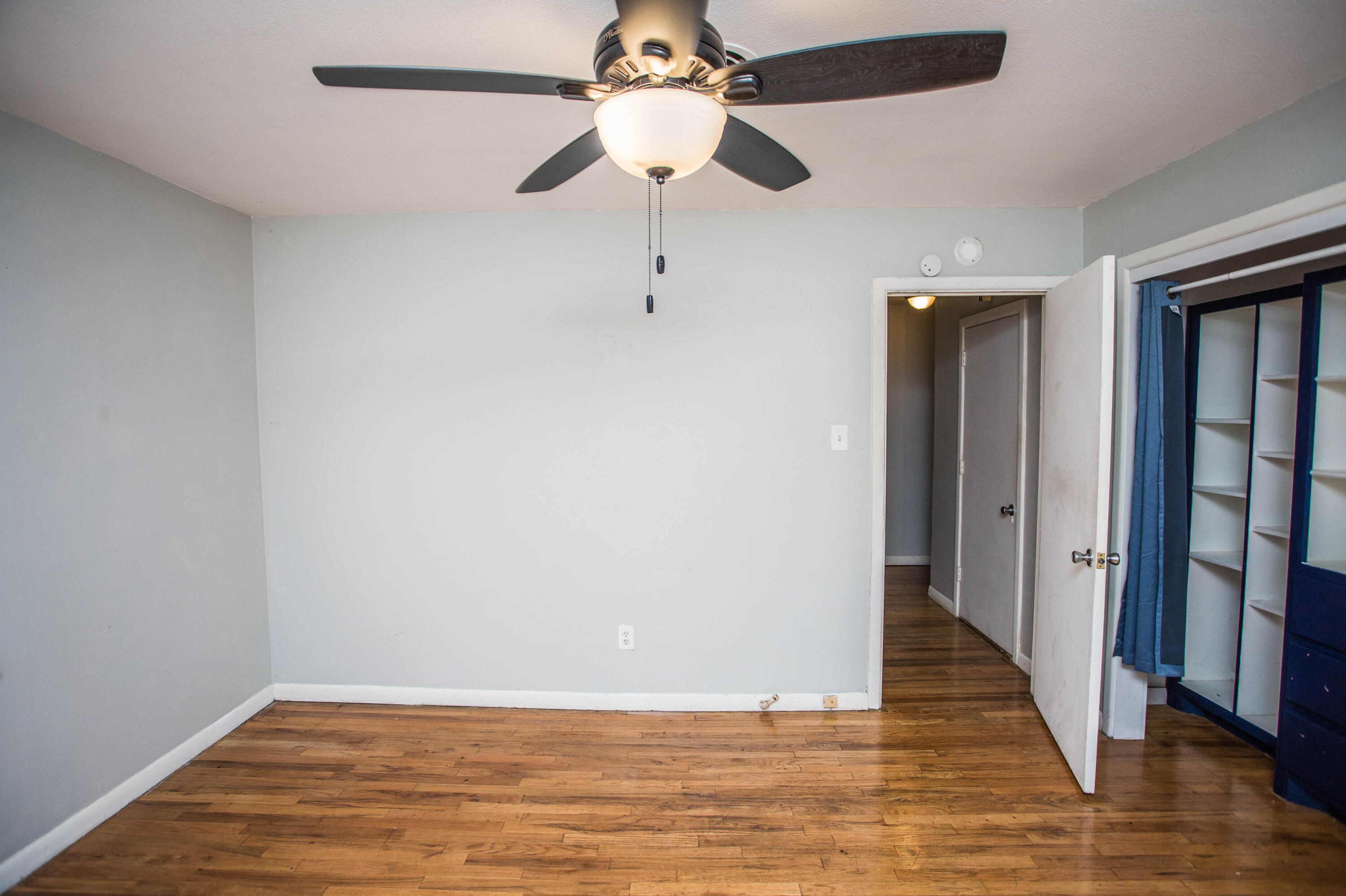 4213 40th Street Lubbock, TX 79413 - Photo 20 of 30 a view of an empty room with wooden floor