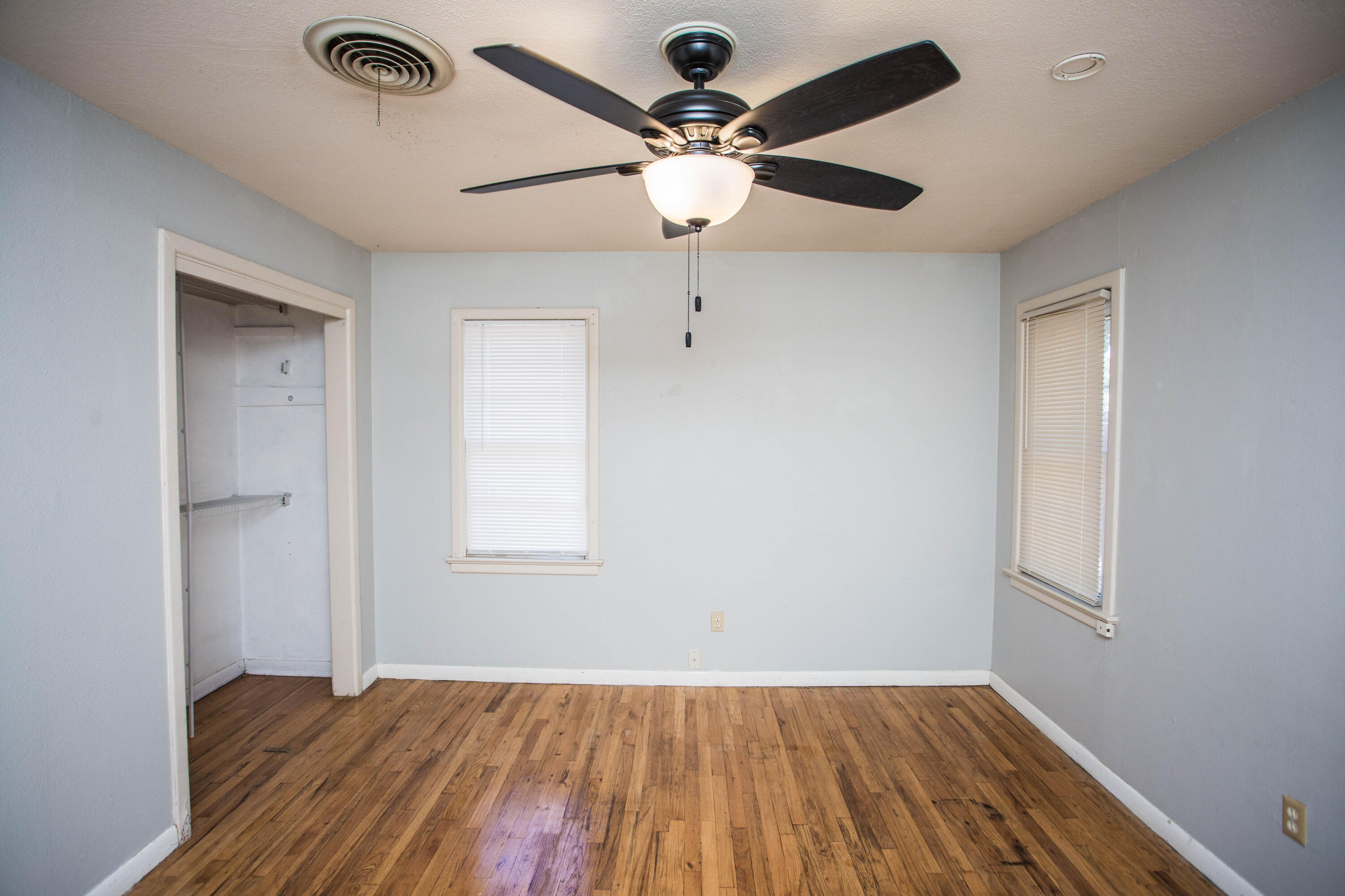4213 40th Street Lubbock, TX 79413 - Photo 24 of 30 wooden floor in an empty room with a window
