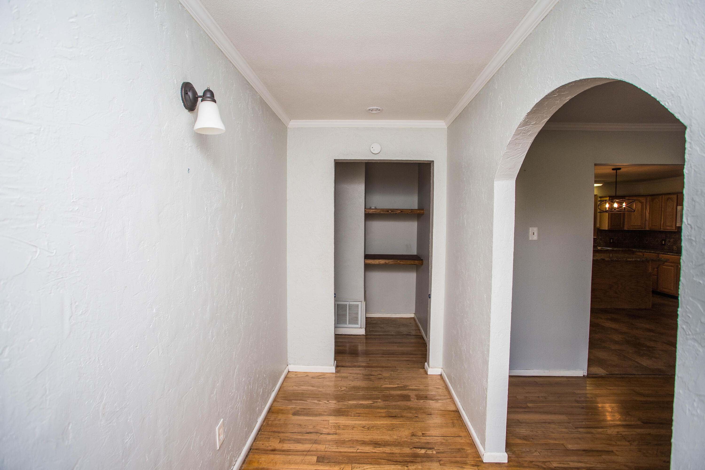 4213 40th Street Lubbock, TX 79413 - Photo 3 of 30 a view of a livingroom from a hallway