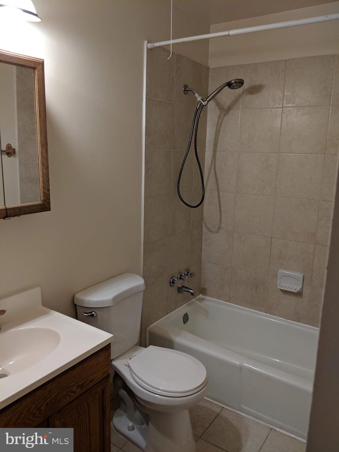 7760 Matisse Way Springfield, VA 22153 - Photo 14 of 21 a bathroom with a sink a toilet and shower