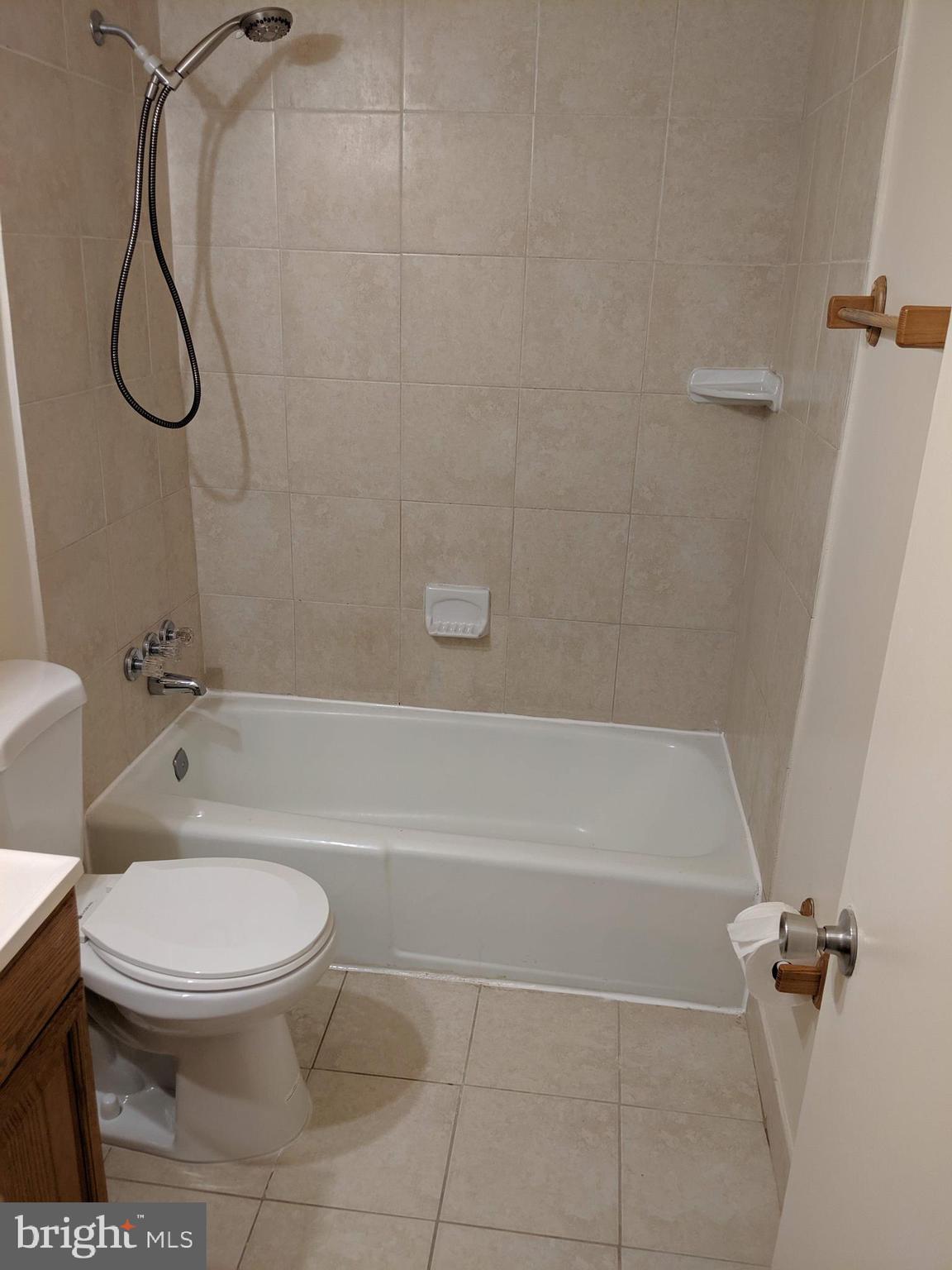 7760 Matisse Way Springfield, VA 22153 - Photo 15 of 21 a bathroom with a toilet and a shower