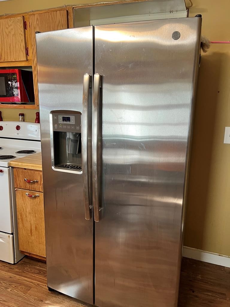 2034 Old River Road Charleston, TN 37310 - Photo 17 of 29 a metallic refrigerator freezer sitting in a kitchen
