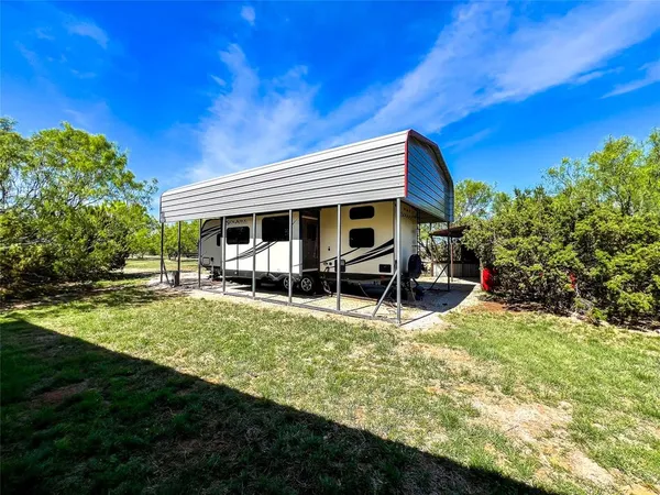 a view of house with backyard porch and sitting area