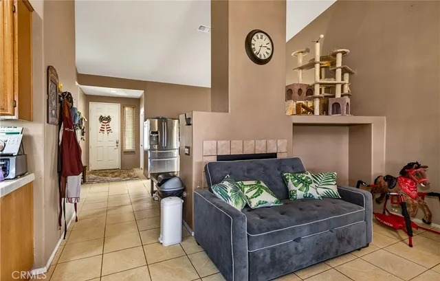 a living room with furniture and a clock