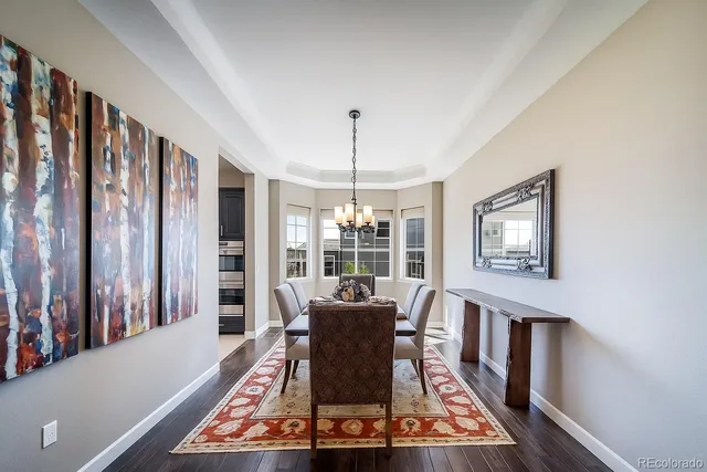 a living room with furniture lamp and large window