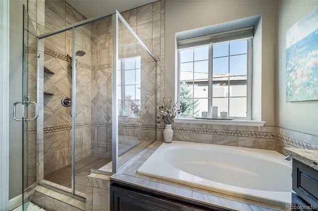 a bathroom with a bathtub and shower