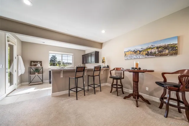 a view of a livingroom with furniture and a dining table