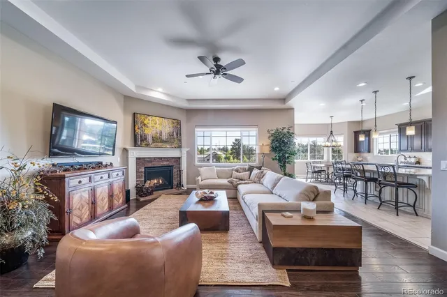 a living room with fireplace furniture and a flat screen tv