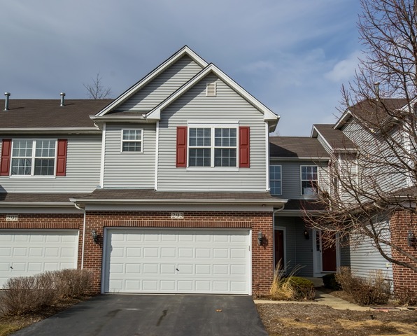 293 Ridge Road North Aurora, IL 60542 - Photo 1 of 21 a front view of a house with a garage