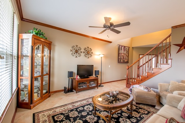 293 Ridge Road North Aurora, IL 60542 - Photo 3 of 21 a living room with furniture and a flat screen tv