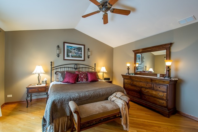 293 Ridge Road North Aurora, IL 60542 - Photo 10 of 21 a bedroom with a bed and wooden floor