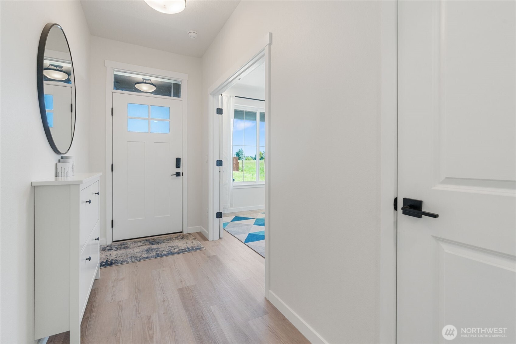 1090 Rw Fletcher Street Winlock, WA 98596 - Photo 23 of 37 a view of an entryway with wooden floor
