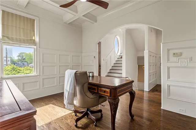 a kitchen with stainless steel appliances granite countertop a stove a sink a refrigerator dining table and chairs