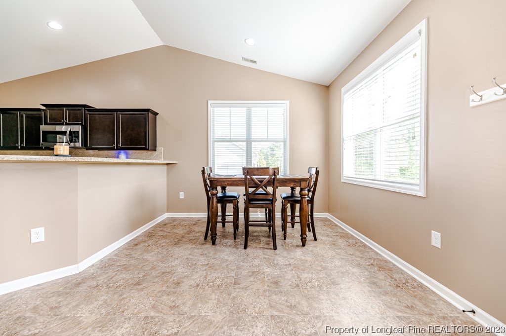 463 Juno Drive Broadway, NC 27505 - Photo 11 of 30 a view of a dining room with furniture and window