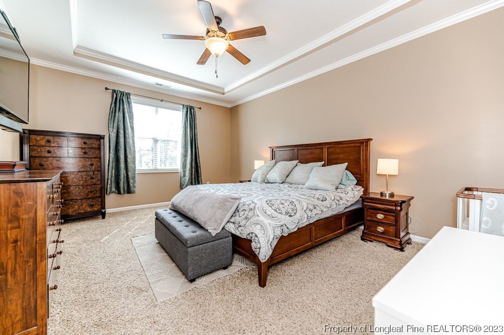 463 Juno Drive Broadway, NC 27505 - Photo 17 of 30 a bedroom with a bed couch and window