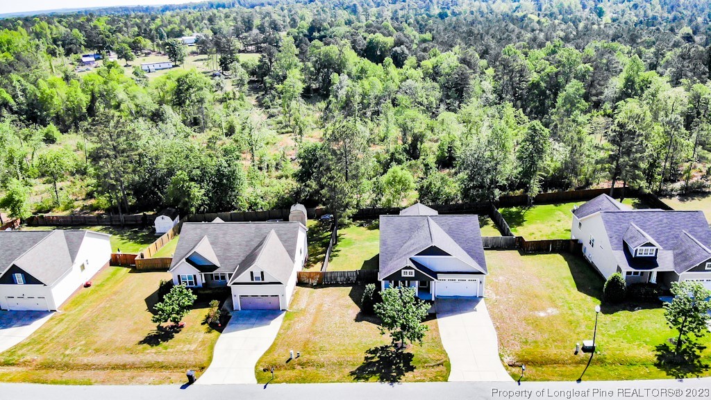463 Juno Drive Broadway, NC 27505 - Photo 2 of 30 an aerial view of a house with swimming pool and garden