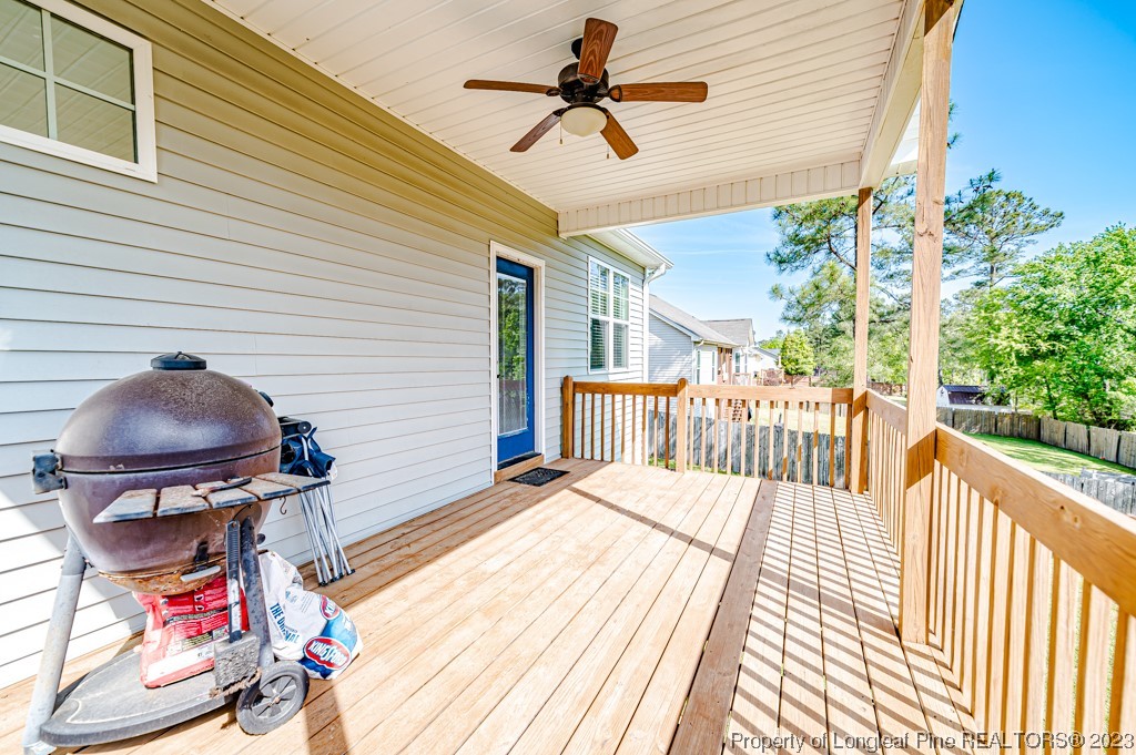 463 Juno Drive Broadway, NC 27505 - Photo 25 of 30 a view of a balcony with furniture and wooden floor