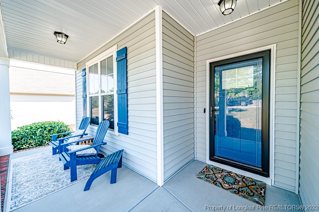 463 Juno Drive Broadway, NC 27505 - Photo 4 of 30 a building outdoor space with patio furniture and potted plants
